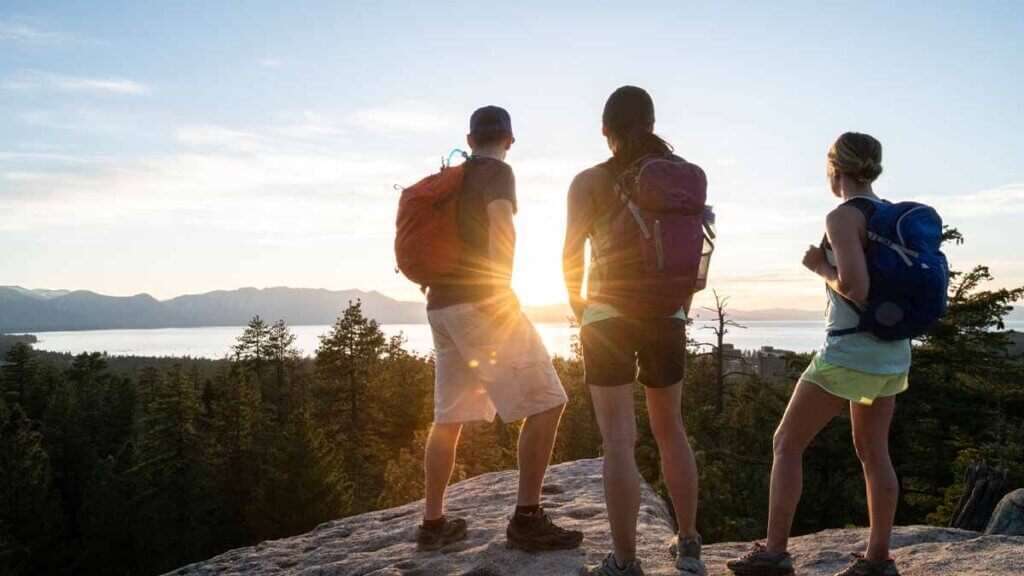 group of people watching sunset in lake tahoe