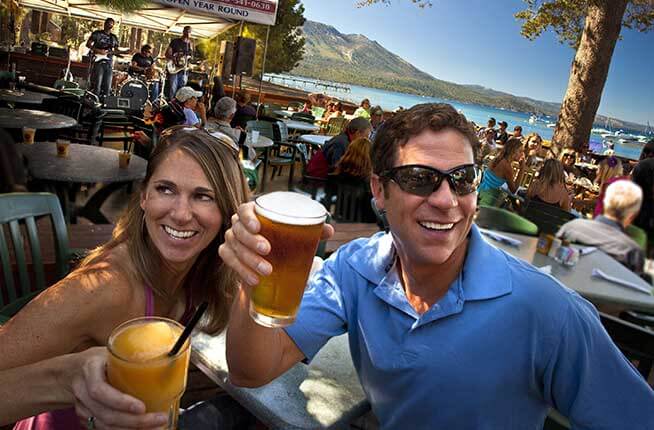 Couple enjoying beverages outside at the Beacon Bar and Grill Lake Tahoe