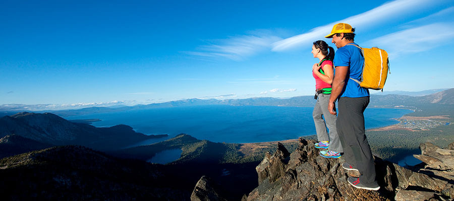 Couple taking in the view from top of Mt. Tallac Lake Tahoe