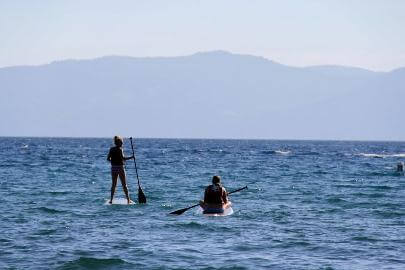 Tourists Paddleboarding in Lake Tahoe