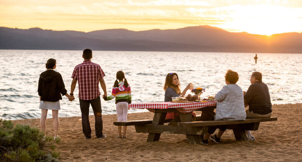 Family watching sunset and having BBQ at Nevada Beach