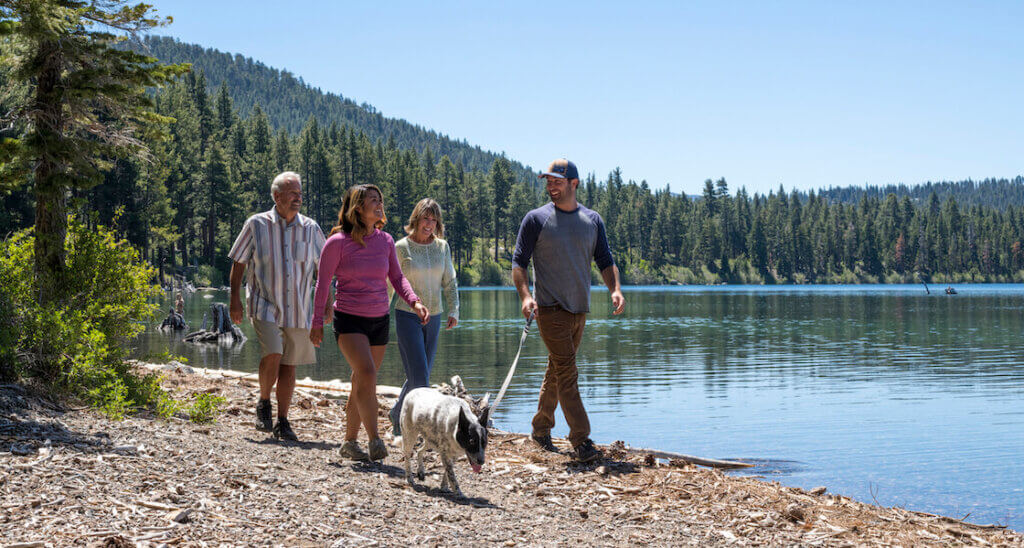 Family walking dog at Fallen Leaf Lake