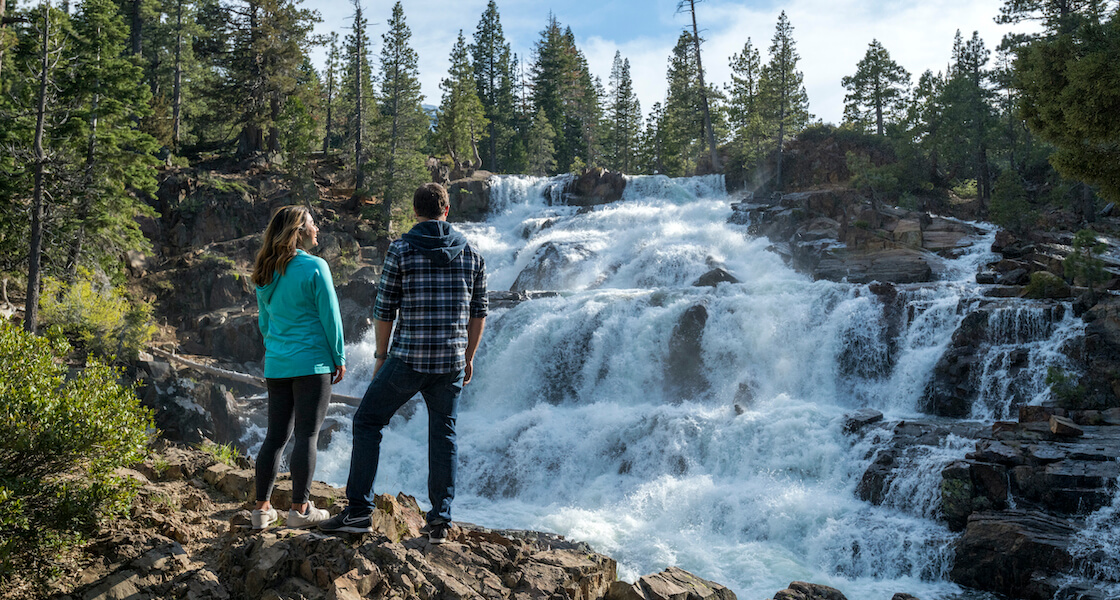 Couple exploring Glen Alpine Waterfall in the spring