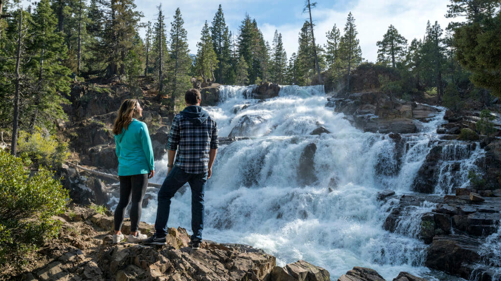 Couple exploring Glen Alpine Waterfall in the spring