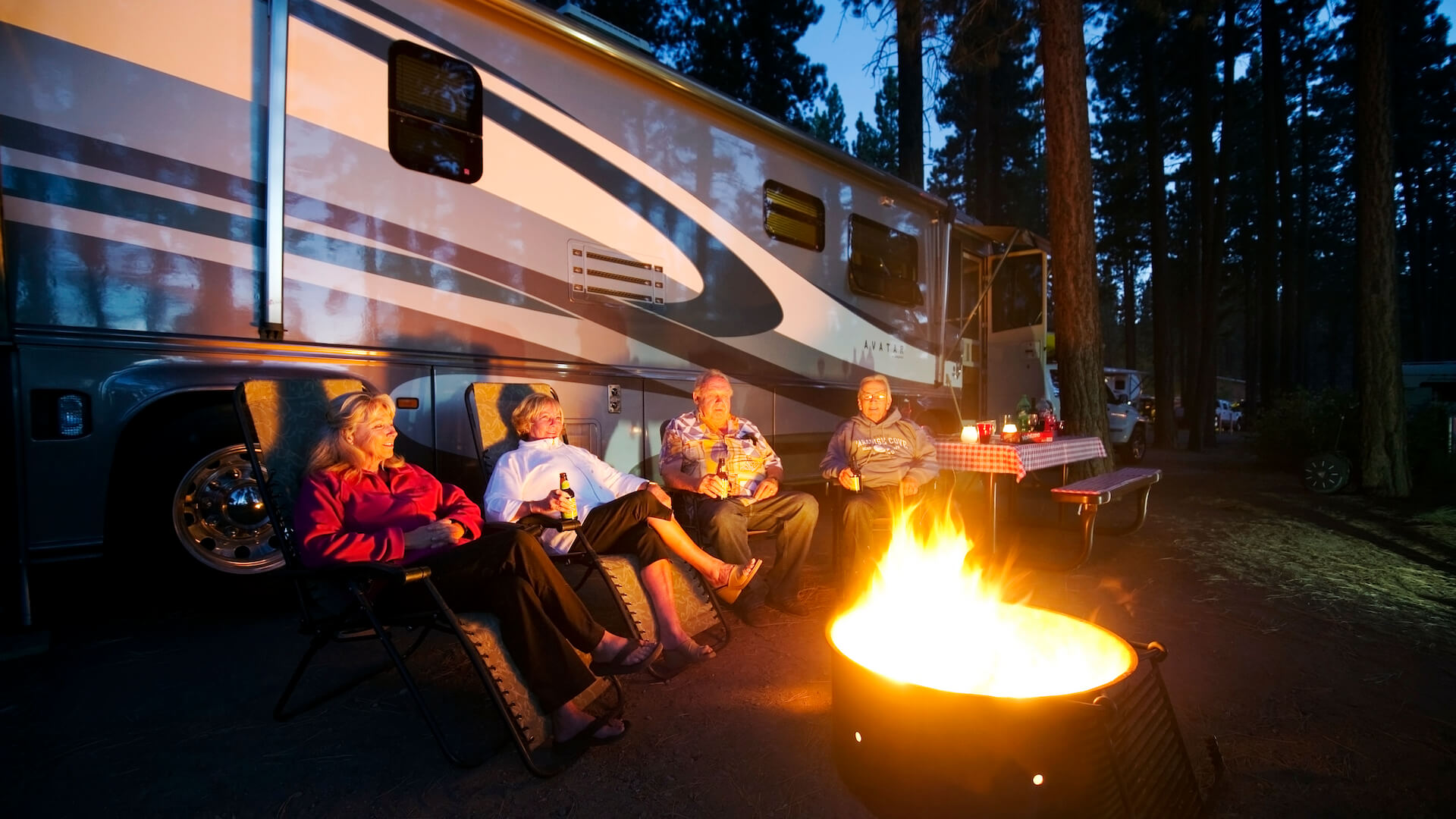 Campers enjoying a campfire at Zephyr Cove RV Park - Rachid Dahnoun / ARAMARK