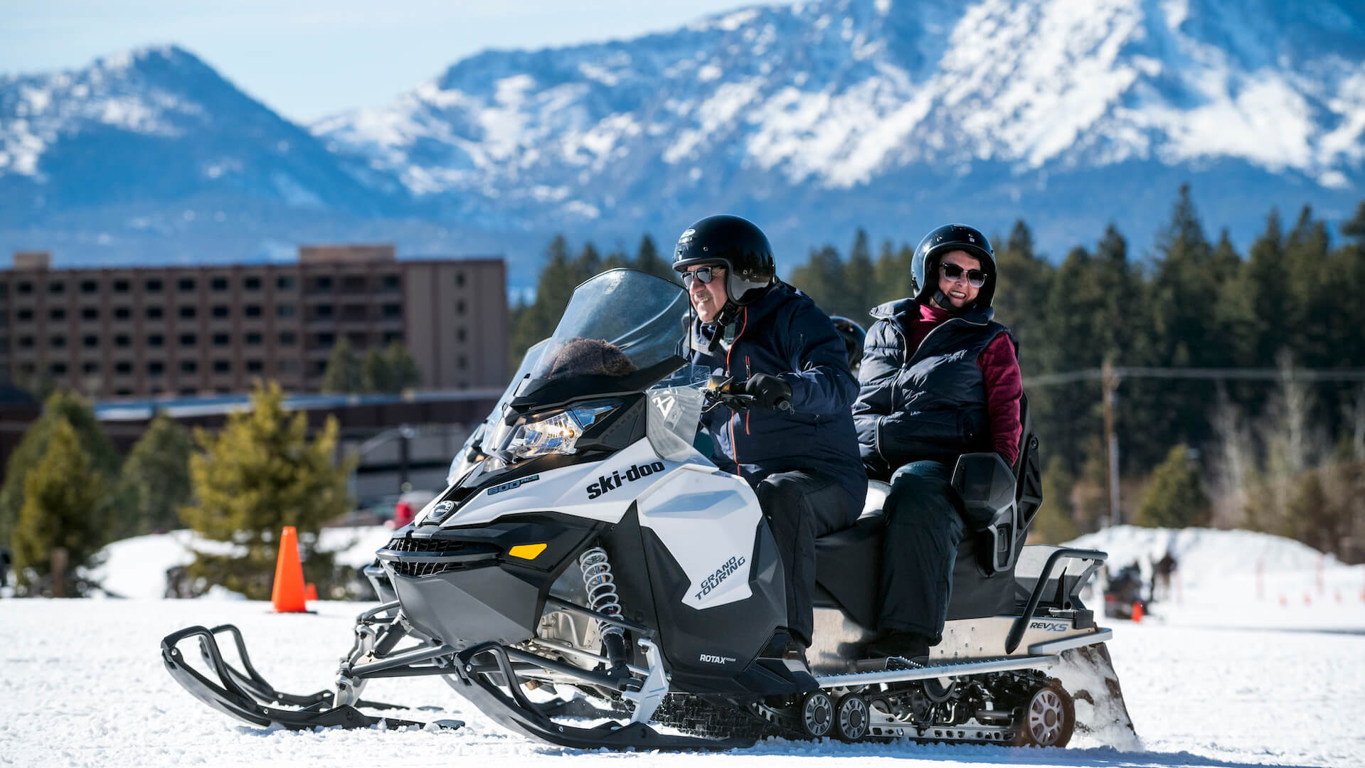 Couple snowmobiling at Stateline - Rachid Dahnoun / Lake Tahoe Visitors Authority