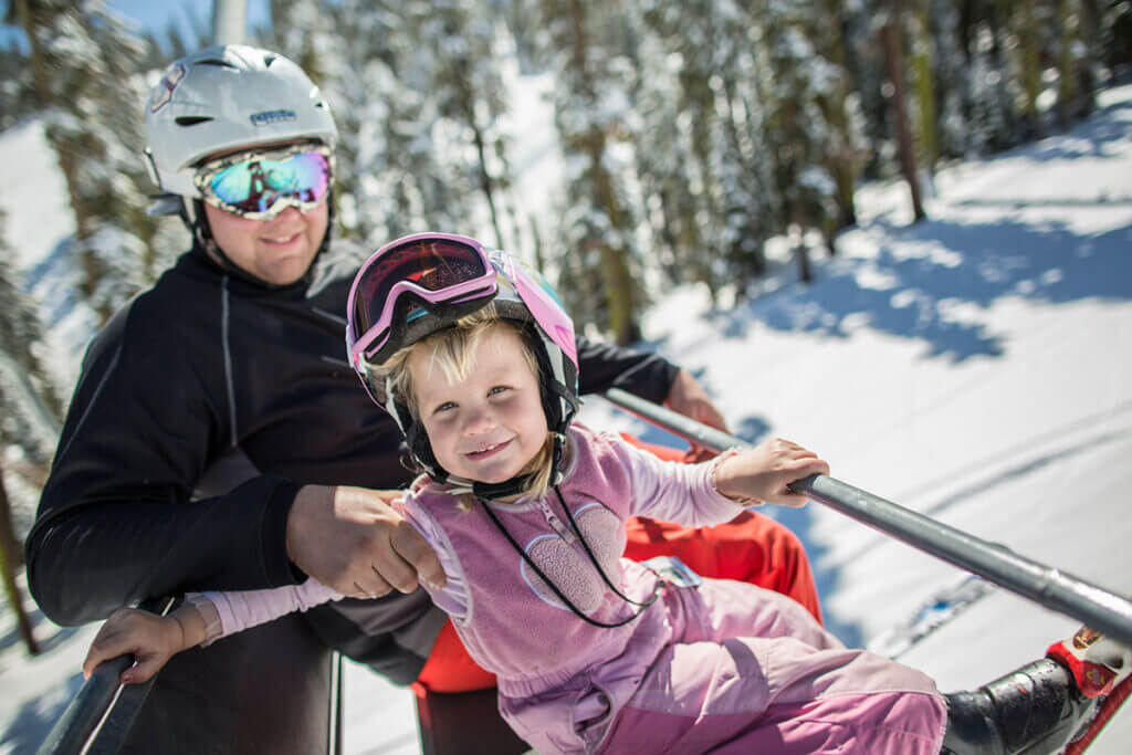Child on ski lift at Sierra-at-Tahoe Lake Tahoe Ski Resort