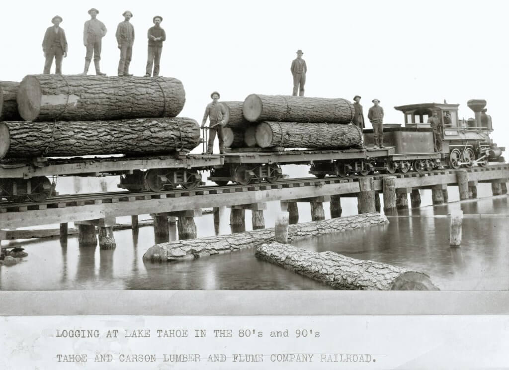 Old time photo - Workers pose with logs headed for one of Tahoe’s lumber mills