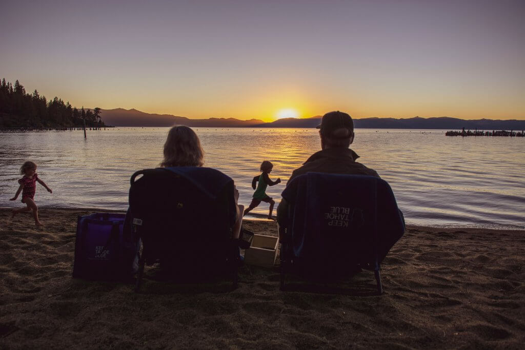 Couple watching sunset on Lake Tahoe