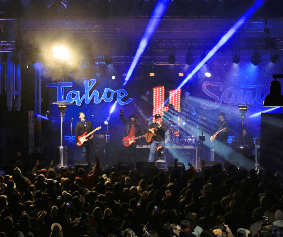 A band playing music on stage in front of a crowd
