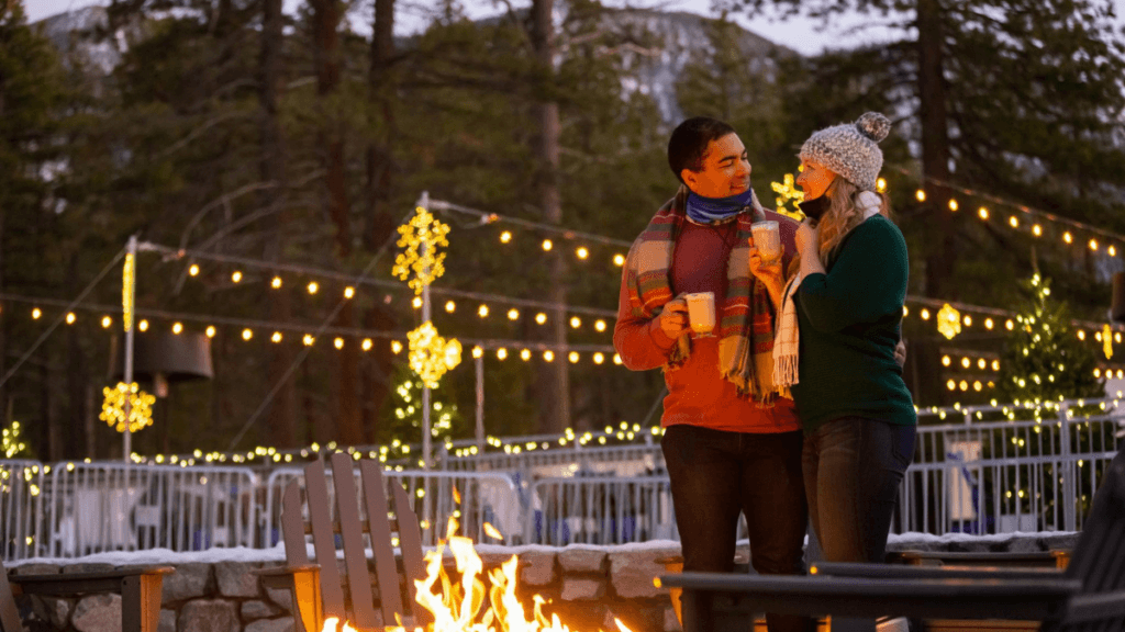 A couple by a fireplace at Edgewood