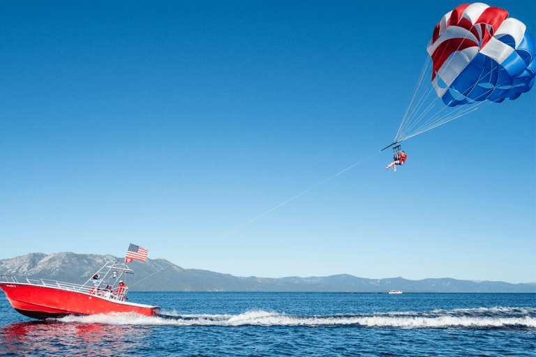friends parasail over lake tahoe