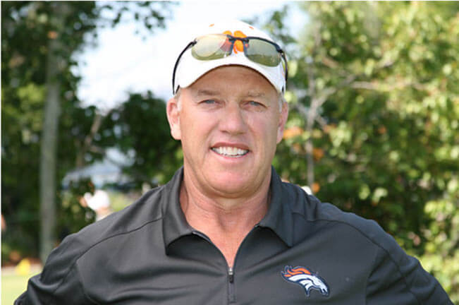 Denver Broncos Hall of Fame quarterback John Elway calls the play