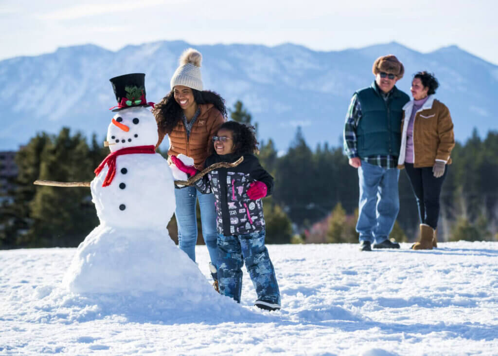 family building snowman in lake tahoe