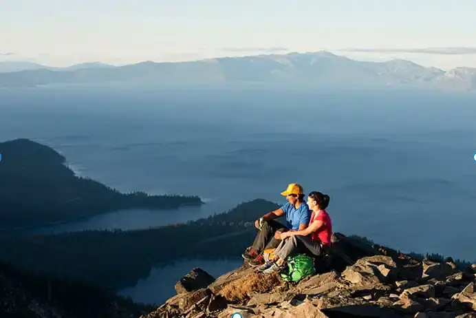 Couple at the top of Mt Tallac Lake Tahoe