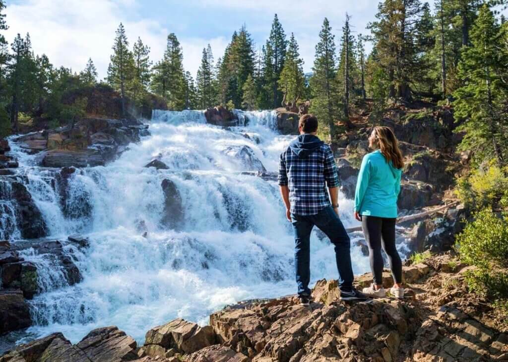 couple by waterfall in tahoe