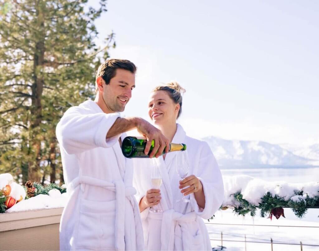 couple drinking champagne at lake tahoe hotel