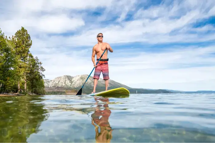 Photo of man paddleboarding on the beautiful waters of Lake Tahoe