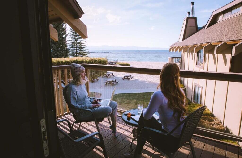 friends on balcony at south lake tahoe hotel